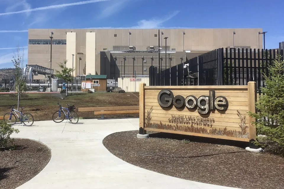 Data center with Google sign in front of black fence in The Dalles, Oregon.